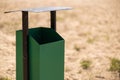 metal trash can on the beach on a sunny day. Conceptual photo of a clean beach Royalty Free Stock Photo