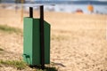 metal trash can on the beach on a sunny day. Conceptual photo of a clean beach Royalty Free Stock Photo