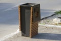 Metal trash can with wooden elements