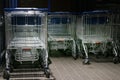 Metal trolleys at supermarket entrance Royalty Free Stock Photo
