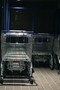 Metal trolleys at supermarket entrance Royalty Free Stock Photo