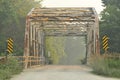 Metal Trusses Bridge on Warren County road wit foggy, soft background Royalty Free Stock Photo