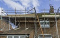 Metal tubular scaffolding around an urban semi detached house re