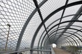 Metal tunnel bridge with wooden walkway. Royalty Free Stock Photo