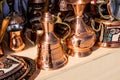 Metal Turkish pitchers, vases and containers next to each other