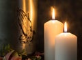Metal urn with praying hands and burning candles . End of Life Royalty Free Stock Photo