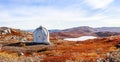 Metal US bunker and autumn greenlandic orange tundra landscape w