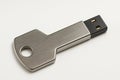 A metal USB drive in the shape of a key. Royalty Free Stock Photo