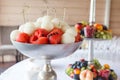 Metal vase with watermelon and melon balls on skewers. Healthy food on event Royalty Free Stock Photo