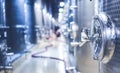 Metal vats for fermentation. Wine factory. Steel barrels in winery.