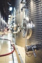 Metal vats for fermentation. Wine factory. Steel barrels in winery.