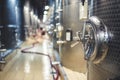 Metal vats for fermentation. Wine factory. Steel barrels in winery.