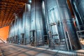 metal vats in which wine or beer is fermented at the factory at the winery. Concept of technologies and equipment for the Royalty Free Stock Photo