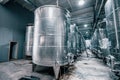 metal vats in which wine or beer is fermented at the factory at the winery. Concept of technologies and equipment for the