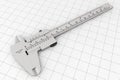 Metal Vernier Caliper over Graph Paper