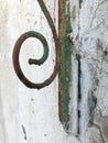 Rusted metal forged visor. Whitewashed cinder block wall. Retro abstraction.