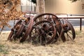 Metal wagon wheel rims for sale chained to a pole.