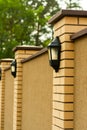 Metal wall lamp on a stone fence Royalty Free Stock Photo