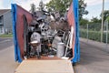 Metal waste collected in a container in a community disposal place.