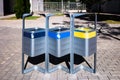 Metal waste separation bins on a public street Royalty Free Stock Photo