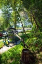 Metal water wheel. Wooden barrel with clean water