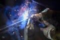 Metal welding. Fire from operation of welding machine. Manufacture of steel seam. Processing of steel profile. Sparks from welding