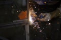 Metal welding. Fire from operation of welding machine. Manufacture of steel seam. Processing of steel profile. Sparks from welding