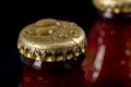 Metal wet cap on a dark glass bottle. A tasty drink closed with a cap. Royalty Free Stock Photo