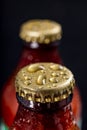 Metal wet cap on a dark glass bottle. A tasty drink closed with a cap. Royalty Free Stock Photo