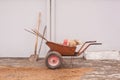 Metal wheelbarrow cart and shovels on construction sites