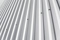 Metal white sheet for industrial building and construction. Roof sheet metal or corrugated roofs of factory building or Royalty Free Stock Photo