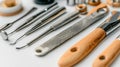 Metal and wood tools on white surface for detailed work Royalty Free Stock Photo