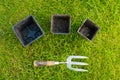 Metal and Wooden Hand Fork and some Plant Pots