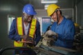 Metal work factory technician inspector and worker in lathe workshop Royalty Free Stock Photo