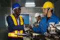 Metal work factory technician inspector and worker in lathe workshop Royalty Free Stock Photo