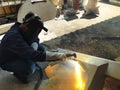 Metal workers use manual labor, The welder is cutting