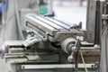Close up shot of metal working machine tool bed controls, selective focus Royalty Free Stock Photo