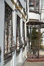 Metal wrought-iron bars on windows of apartment house Royalty Free Stock Photo