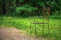 Metal wrought-iron outdoor chair in the Park