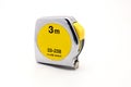 Metal yellow tape measure on white background flexible ruler used to measure distance.