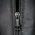 Metal zipper on black synthetic fabric