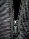 Metal zipper on black synthetic fabric