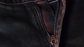 Metal zipper of jeans close-up. Blue denim fabric. Macro shot Royalty Free Stock Photo