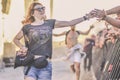 Metalhead runs under the stage, Hellfest festival, Clisson, France.