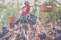 Metalhead in wheelchair during a crowdsurfing at a metal concert