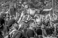 Metalhead in wheelchair during a crowdsurfing at a metal concert