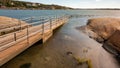 Metallic jetty half submerged in Baltic sea water at gothenburg sweden glowing in sun light