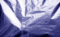 Metalized plastic wrap texture with crumples in blue color Royalty Free Stock Photo
