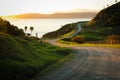 Metalled rural road with baton and wire fence, Mahia Peninsula, North Island, New Zealand Royalty Free Stock Photo