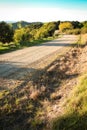 Metalled rural road with baton and wire fence, Mahia Peninsula, North Island, New Zealand Royalty Free Stock Photo